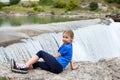 Portrait of pre-teen girl resting close to waterfall of the Cijevna river. It is called Montenegrin Niagara Falls. Surroundings of Royalty Free Stock Photo