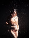 Portrait of pregnancy asian woman in bikini in water drop. Royalty Free Stock Photo