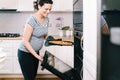 Portrait of pregnant woman preparing pizza at home Royalty Free Stock Photo