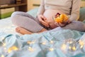 Portrait of pregnant woman`s belly and healthy food