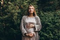 A portrait of Pregnant young woman who enjoys the forest Royalty Free Stock Photo