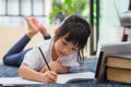 Portrait of preschool kid using tablet for his homework,Soft focus of Child doing homework by using digital tablet searching