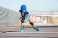 Boy riding on roller skates at outdoor skate park