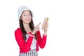 Portrait of pretty Asian teen girl wearing red dress and white hat happily smile using smartphone while working isolated on white Royalty Free Stock Photo