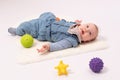 Portrait of a pretty baby girl is plaing with balls Royalty Free Stock Photo
