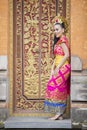 Pretty balinese woman smiling on temple door Royalty Free Stock Photo
