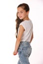 Portrait of lovely beautiful slender child girl in blue jeans Royalty Free Stock Photo