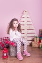 Portrait of pretty beautiful sweet little girl in Christmas interior