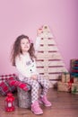 Portrait of pretty beautiful sweet little girl in Christmas interior