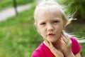 Portrait of pretty blond toddler girl in a windy summer day Royalty Free Stock Photo