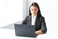 Portrait of pretty business woman with laptop in the offic Royalty Free Stock Photo