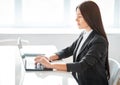 Portrait of pretty business woman with laptop in the offic Royalty Free Stock Photo