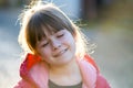 Portrait of a pretty child girl with resting relaxed expression outdoors Royalty Free Stock Photo