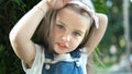 Portrait of pretty child girl standing outdoors in summer park Royalty Free Stock Photo