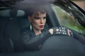 Beautiful young woman sitting in the white car with opened doors Royalty Free Stock Photo