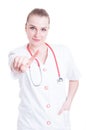 Portrait of pretty female doctor pointing one finger Royalty Free Stock Photo