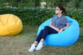 Portrait of pretty female who sat in chair and posing for photog Royalty Free Stock Photo