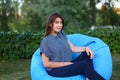 Portrait of pretty female who sat in chair and posing for photog Royalty Free Stock Photo