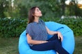 Portrait of pretty female who sat in chair and posing for photog Royalty Free Stock Photo