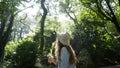 Young woman in sunny forest