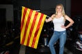 Portrait of pretty girl holding flag of Catalonia