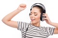 Portrait of pretty girl listening music in headphones and dancing Royalty Free Stock Photo