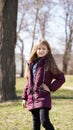 Portrait of pretty girl with long hair in spring in park