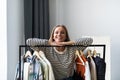 Portrait of a pretty woman looking trough the wardrobe Royalty Free Stock Photo