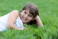 Portrait of a pretty girl lying in the summer park Royalty Free Stock Photo