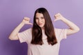 Portrait of a pretty girl pointing finger herself boasting self-concept on purple wall