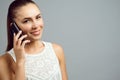 Portrait of a pretty girl smiling and talking on the cell phone. Royalty Free Stock Photo