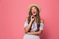 Portrait of pretty glamour woman 20s wearing straw hat laughing