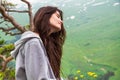 Portrait pretty hipster Woman sitting on mountain top