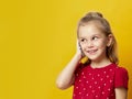 Portrait of a pretty joyful girl in red dress talking on mobile phone Royalty Free Stock Photo