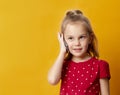 Portrait of a pretty joyful girl in red dress talking on mobile phone Royalty Free Stock Photo