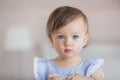 Portrait of a pretty little baby girl in a blue dress Royalty Free Stock Photo