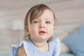 Portrait of pretty little baby girl in a blue dress Royalty Free Stock Photo