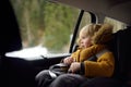 Portrait of pretty little boy sitting in car seat during roadtrip or travel. Family car travel with kids Royalty Free Stock Photo