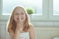 Portrait of pretty little child girl with white towel after show Royalty Free Stock Photo