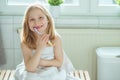 Portrait of pretty little child girl with white towel after show Royalty Free Stock Photo