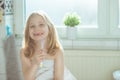 Portrait of pretty little child girl with white towel after show Royalty Free Stock Photo