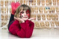 Portrait of pretty little girl with butterfly painting on her fa Royalty Free Stock Photo