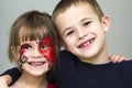 Portrait of pretty little girl with butterfly painting on her fa Royalty Free Stock Photo