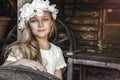 Portrait of pretty little girl. Fashion portrait of beautiful little girl with wreath and white dress. Spring fashion and Royalty Free Stock Photo