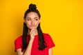 Portrait of pretty minded cheerful girl looking aside copy space dilemma learn isolated over bright yellow color Royalty Free Stock Photo