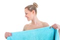 Portrait of the pretty naked woman covering her body with blue towel, isolated on white background