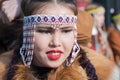Portrait pretty smiling female in traditional clothing indigenous inhabitants of Kamchatka Peninsula. Celebration Koryak