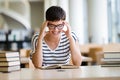 Portrait of a pretty smiling girl reading book in library Royalty Free Stock Photo