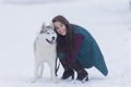 Portrait of Pretty Smiling Woman Hugging Her Husky Dog Outside Royalty Free Stock Photo