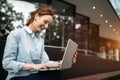 Portrait of pretty student or businesswoman in smart casual using digital tablet Royalty Free Stock Photo